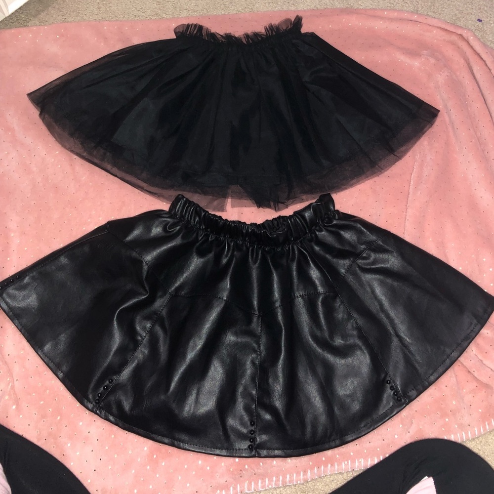 Two brand new black skirts. One is leather